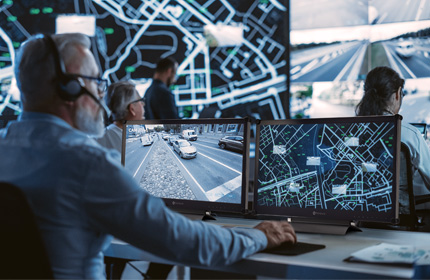 AG Neovo 24 inch SDI monitor is being used by a man in traffic control room