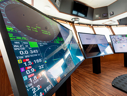 AG Neovo Marine Display with NeoV Optical Glass cover is showing ship system interface in 4 multi view quadview in a bright daylight